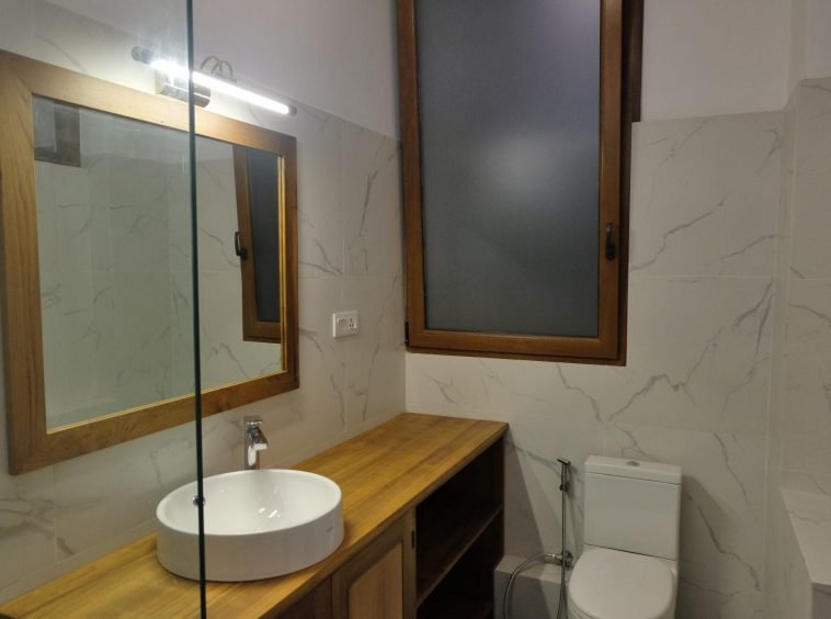 guest bathroom with mirror