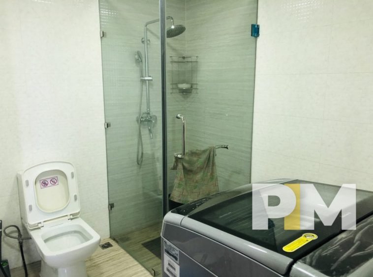 bathroom with washing machine in yangon apartment