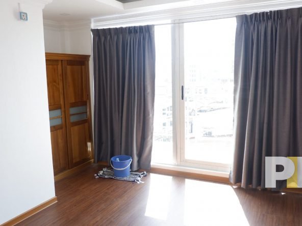 bedroom with separate balcony in penthouse for rent