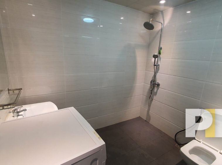 bathroom with shower in sanchaung garden condo for rent