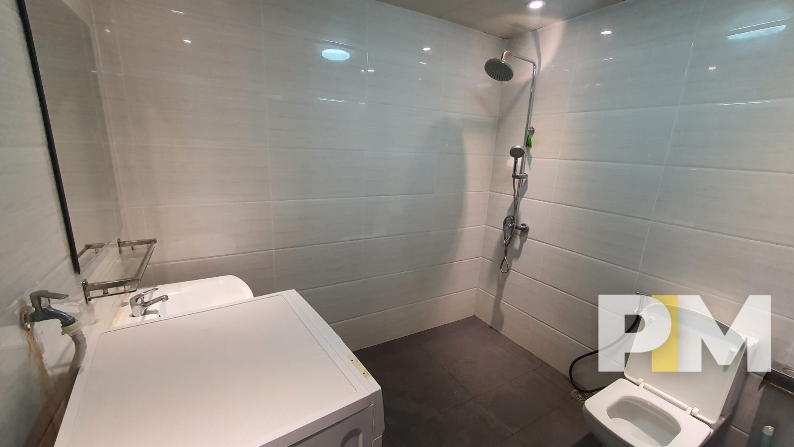 bathroom with shower in sanchaung garden condo for rent