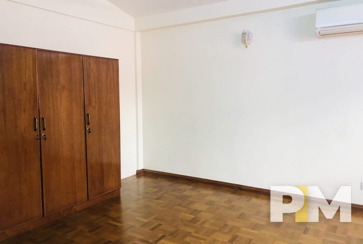 bedroom with large wardrobes - myanmar real estate