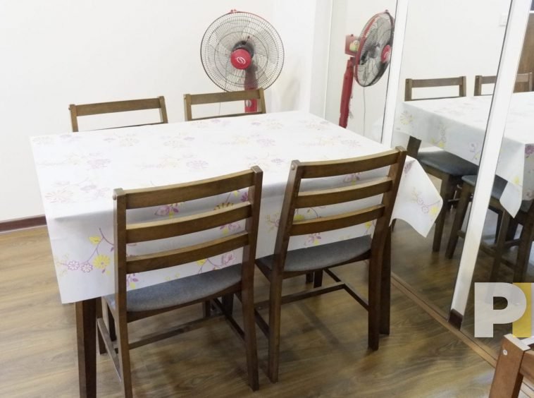 dining table and chairs with a fan - yangon real estate