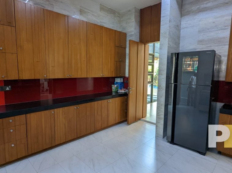 large kitchen with fridge freezer - real estate in myanmar