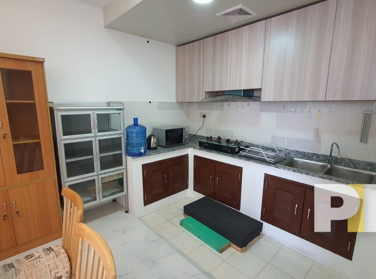 kitchen with microwave and gas stove - real estate in myanmar