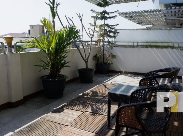 large terrace with chairs and plants - myanmar real estate