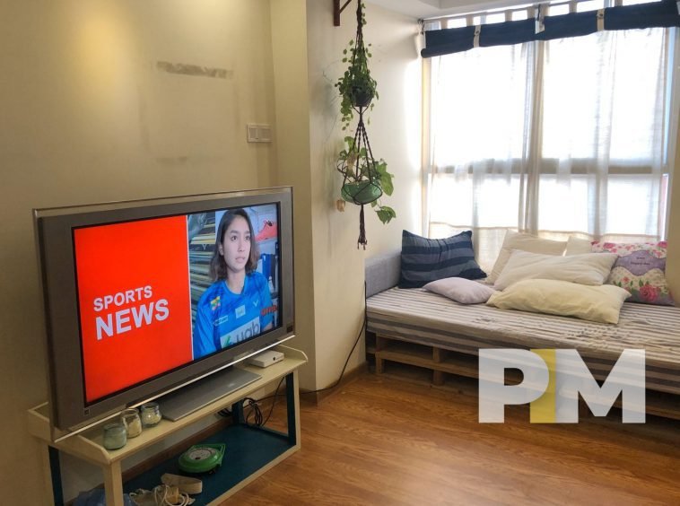 living room with sofa and TV - real estate in yangon