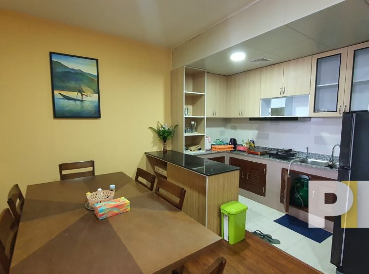 open plan kitchen and dining room in apartment for rent in yangon