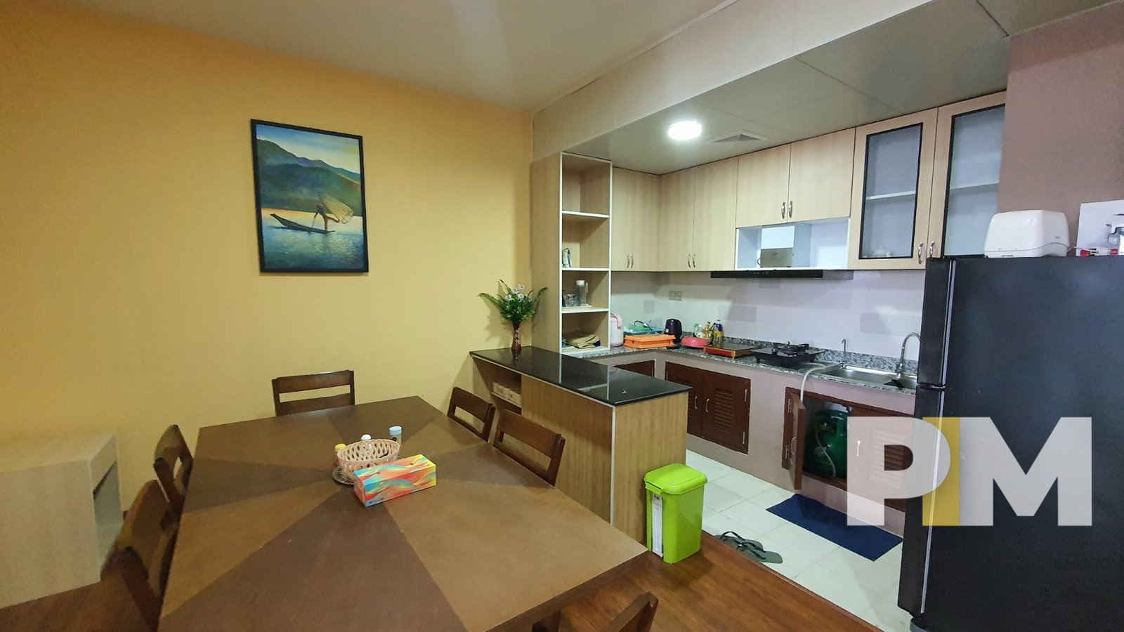 open plan kitchen and dining room in apartment for rent in yangon