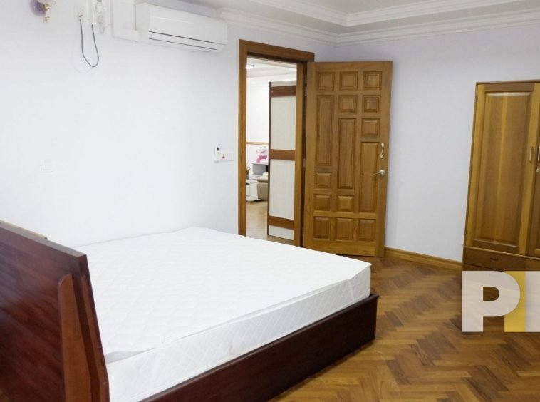 wooden bed frame and mattress - yangon real estate