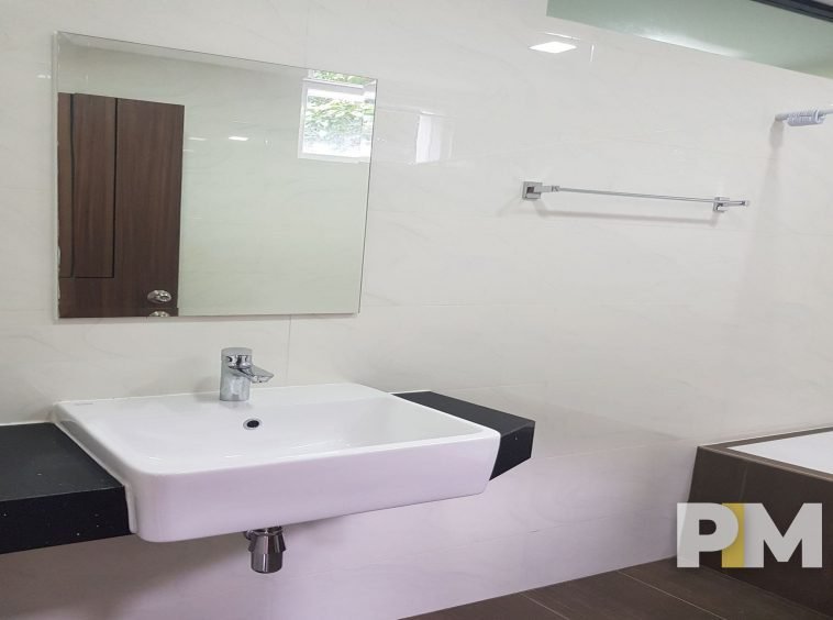 bathroom with mirror - property in Yangon