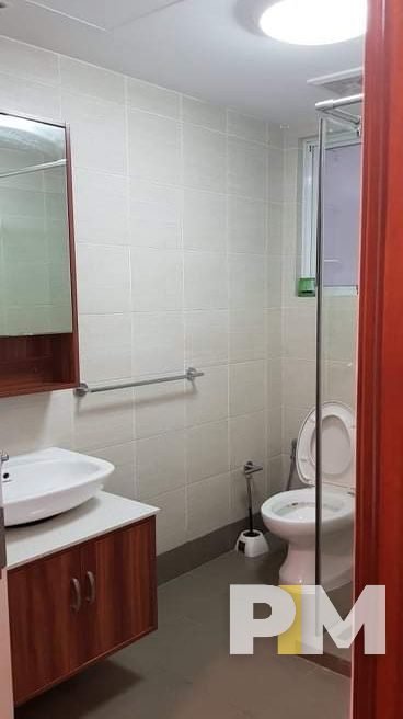 bathroom with mirror - property in Yangon