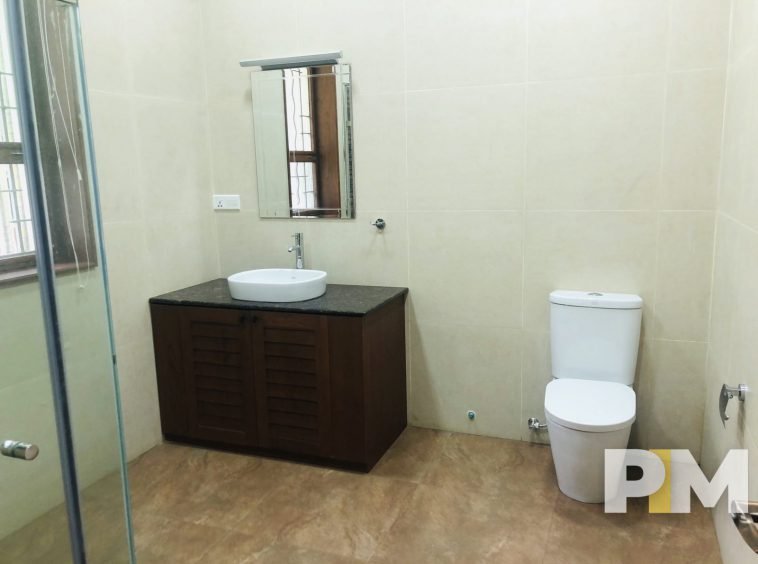 bathroom with mirror - property in Yangon