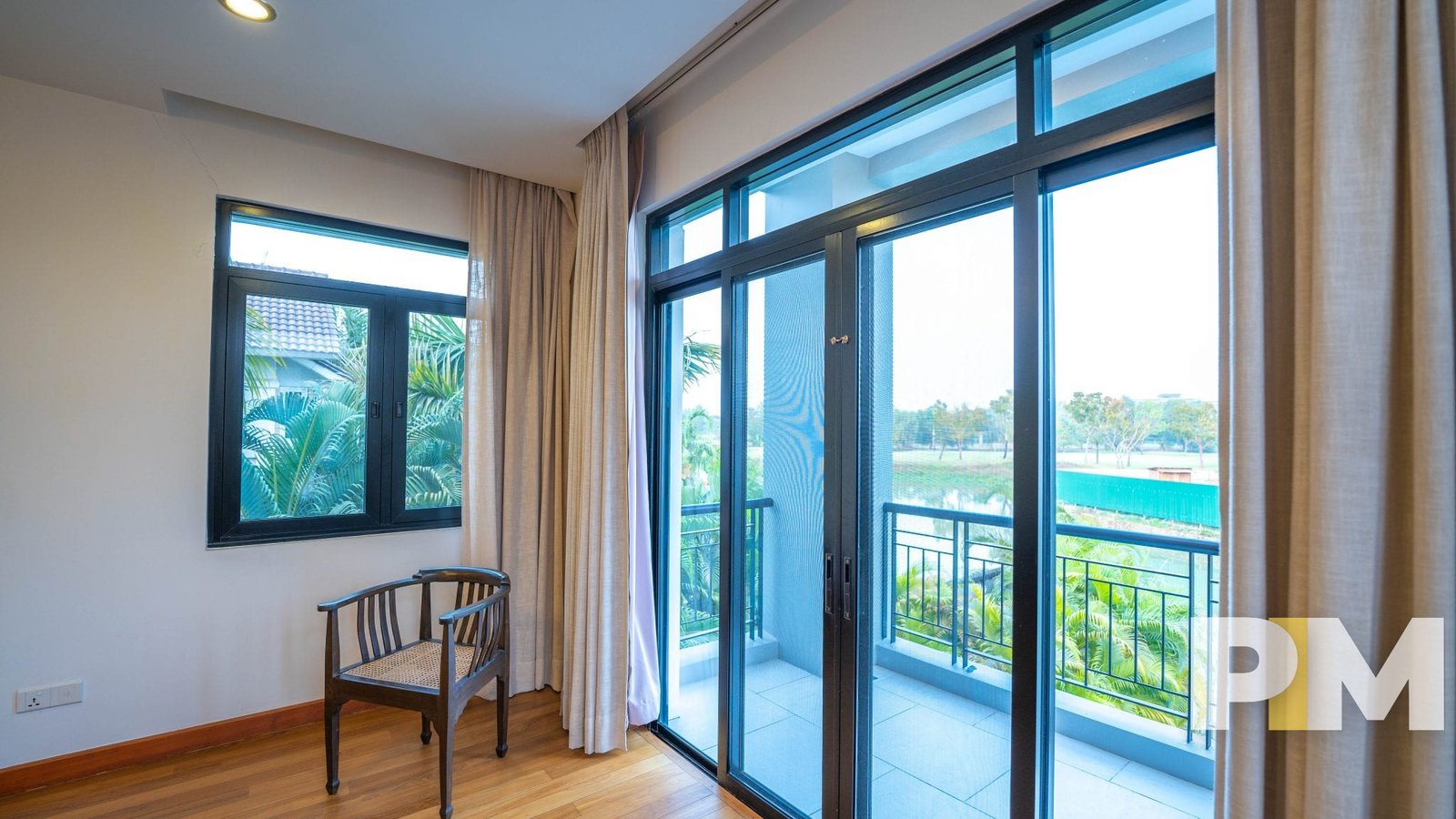 bedroom with balcony - property in Myanmar