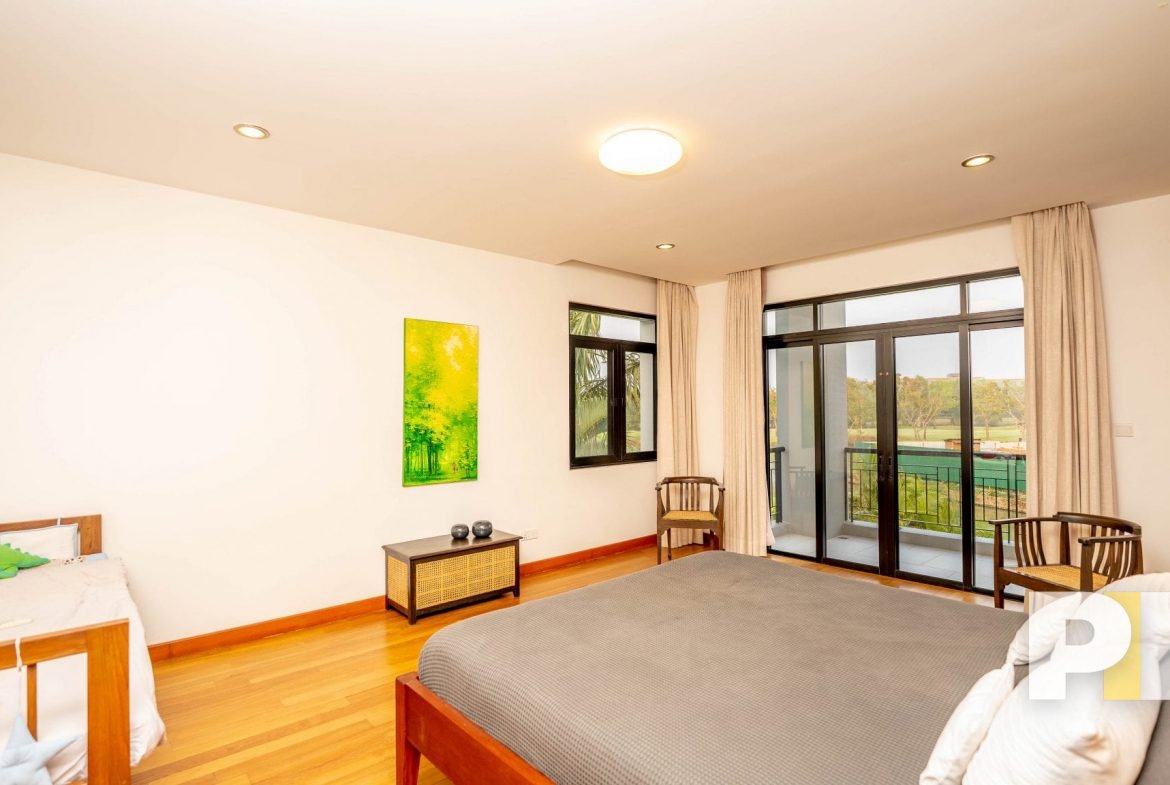 bedroom with balcony - property in Yangon