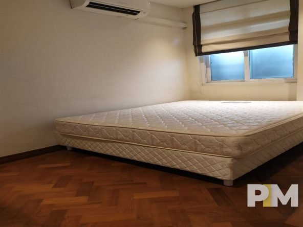 bedroom with bed and mattress - Yangon Real Estate