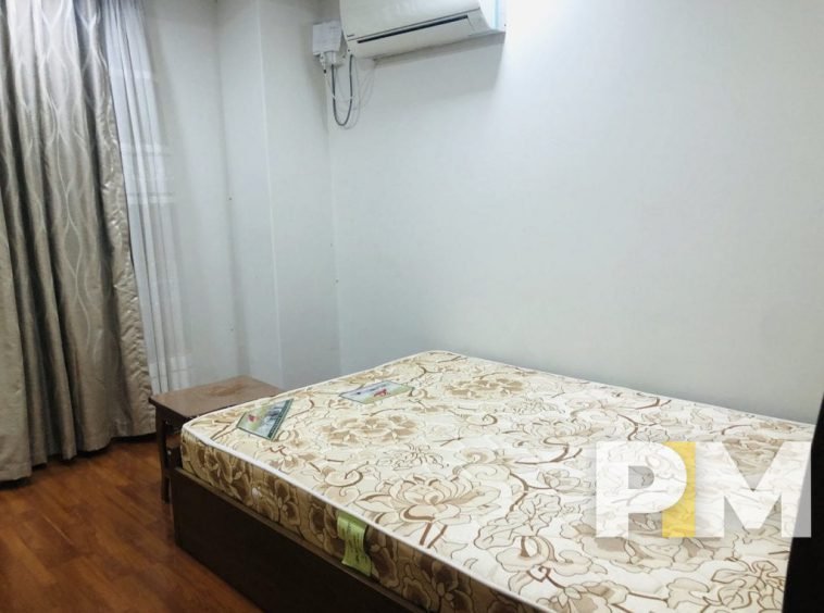 bedroom with bed aned mattress - property in Yangon