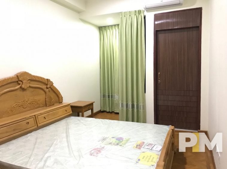 bedroom with bedside desk - Yangon Real Estate