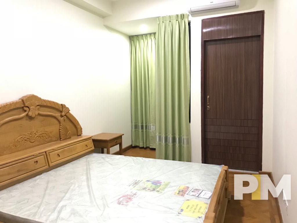 bedroom with bedside desk - Yangon Real Estate