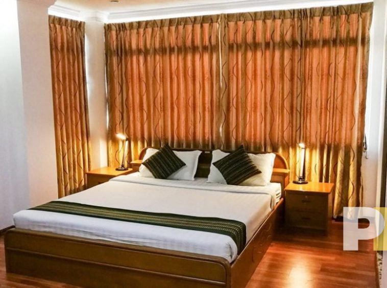 bedroom with bedside desk - Yangon Real Estate