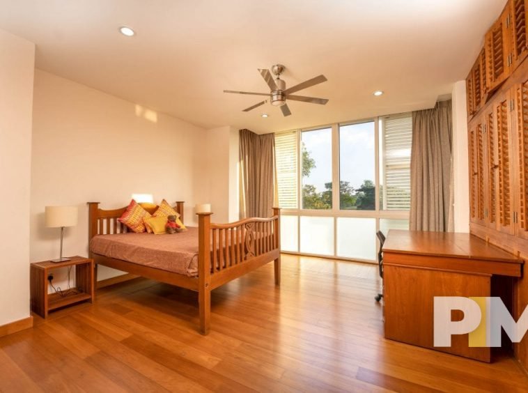 bedroom with ceiling fan - property in Yangon