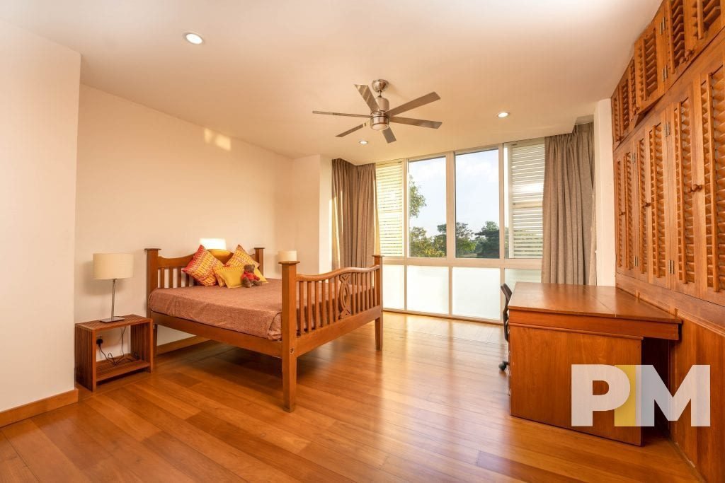 bedroom with ceiling fan - property in Yangon