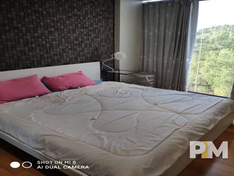 bedroom with curtains - property in Yangon