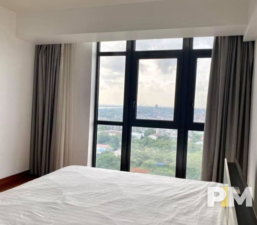 bedroom with outside view - Yangon Real Estate