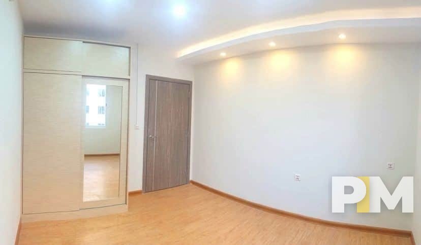 bedroom with wardrobe - property in Yangon