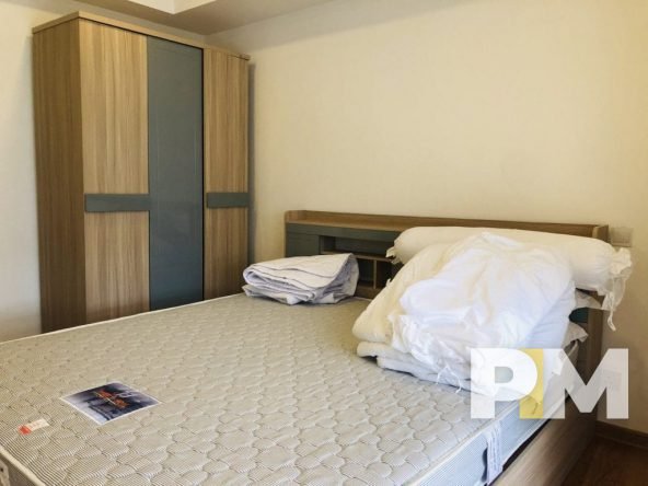 bedroom with wardrobe - property in Yangon