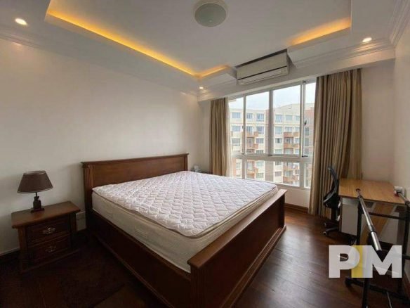 bedroom with working desk - property in Yangon