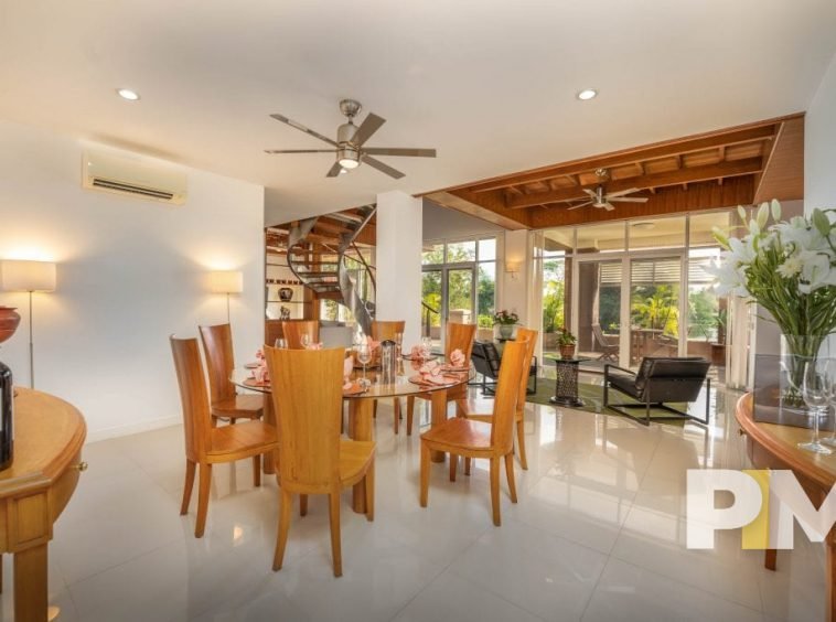 dining room with dining table and chairs - property in Yangon