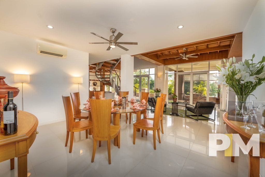 dining room with dining table and chairs - property in Yangon