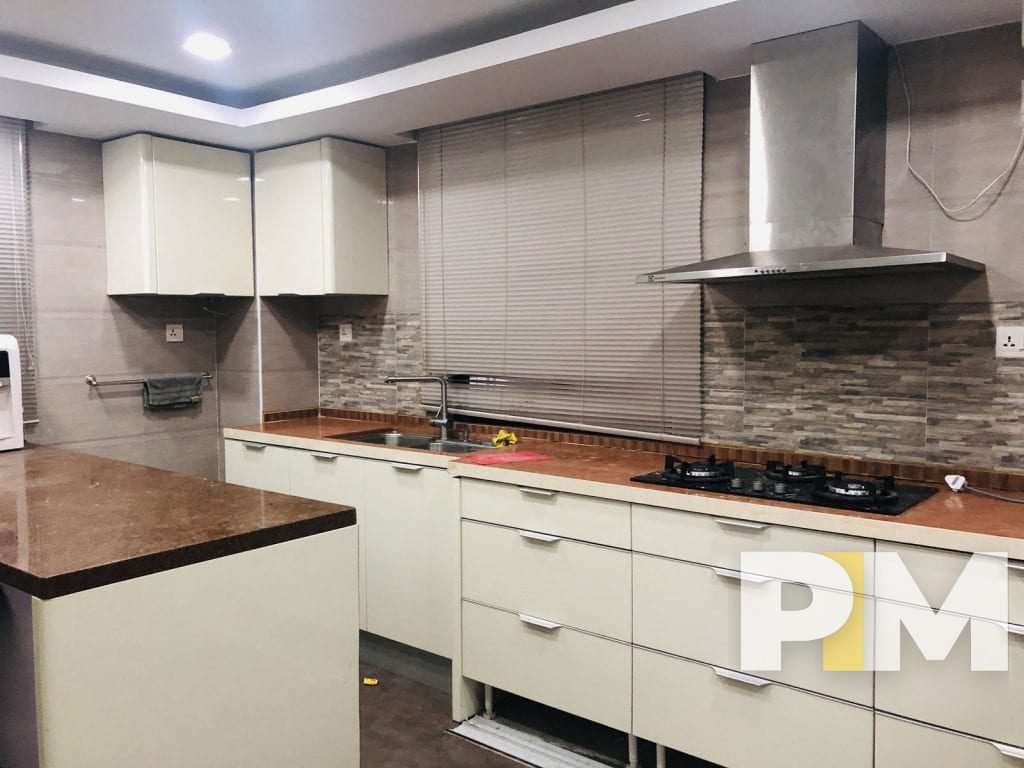 kitchen with cabinets - property in Yangon