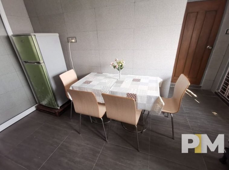 kitchen with dining table and chairs - property in Yangon