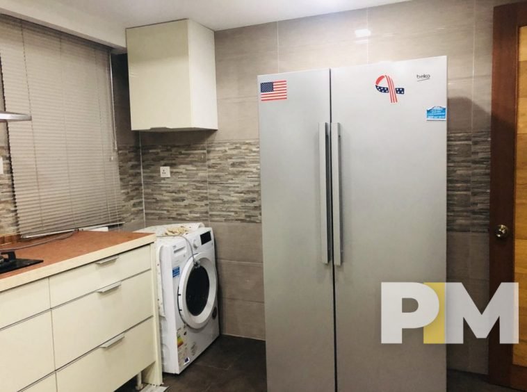 kitchen with fridge - property in Yangon