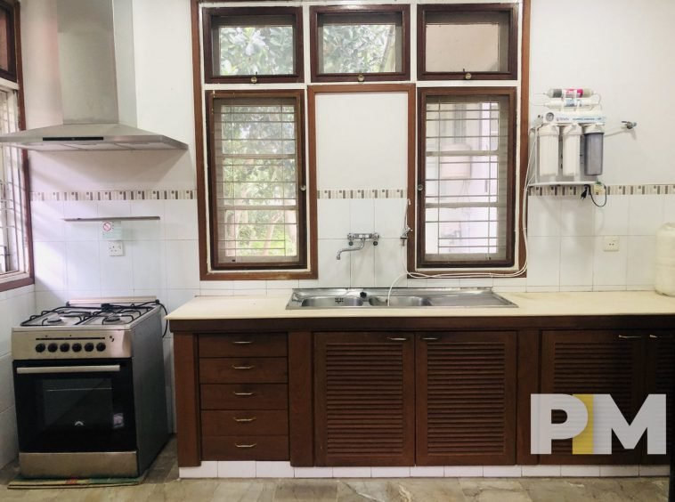 kitchen with stove - property in Yangon