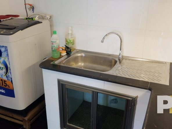 kitchen with washing machine - property in Yangon