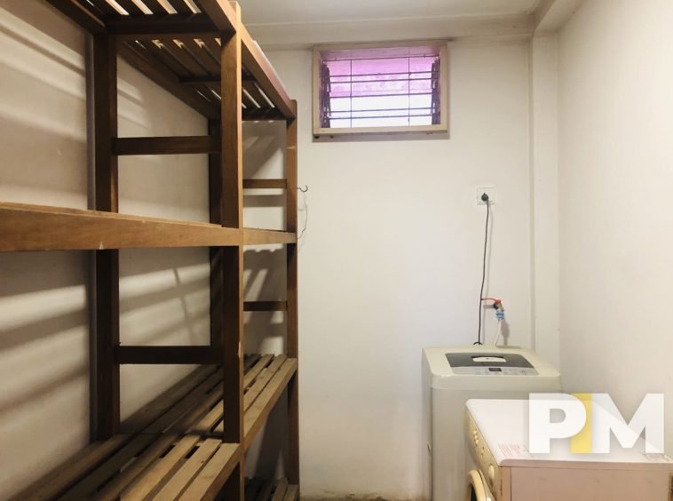 laundry room with washing machine - property in Yangon