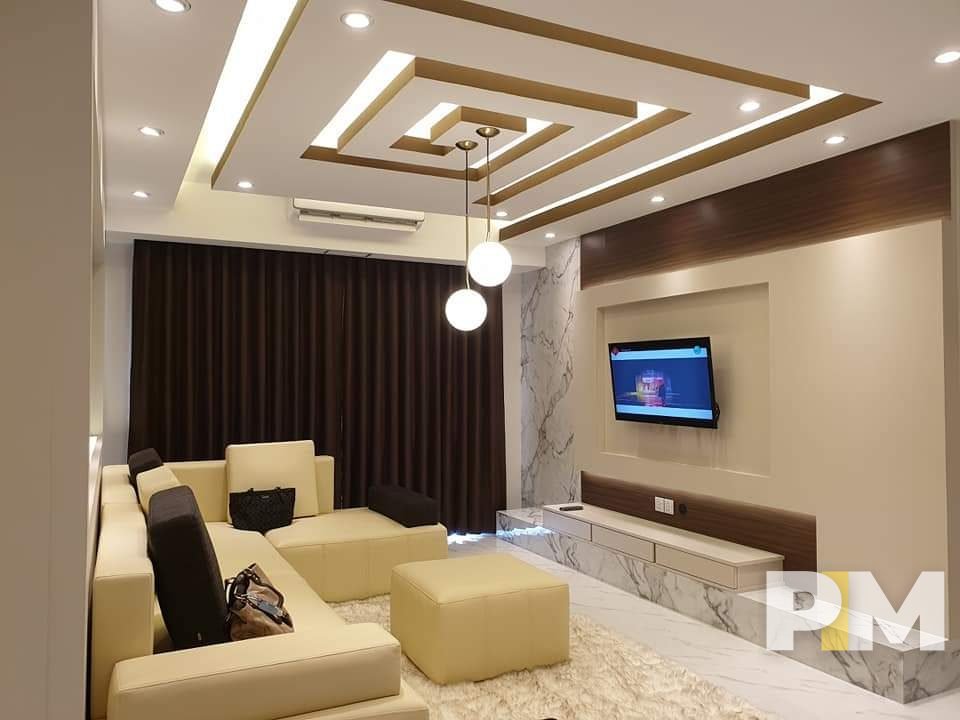 living room with TV - property in Myanmar