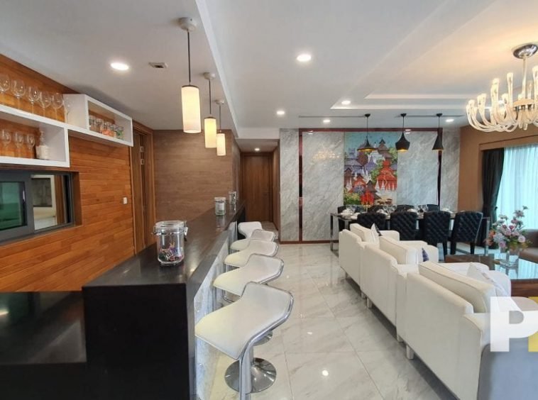 living room with bar table - property in Yangon