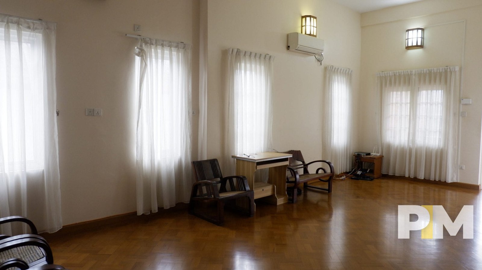 living room with chairs - property in Yangon