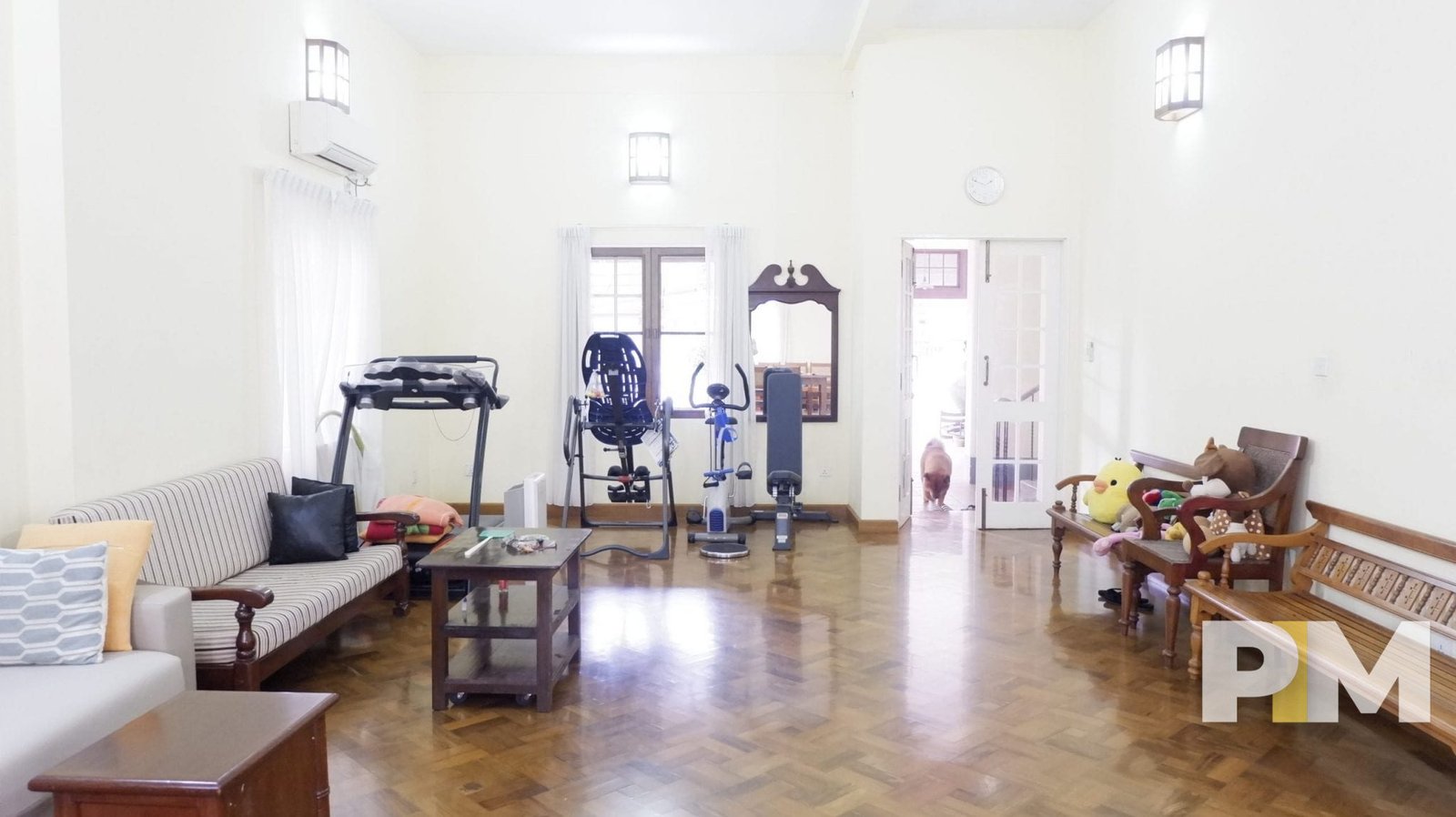 living room with gym accessories - property in Yangon
