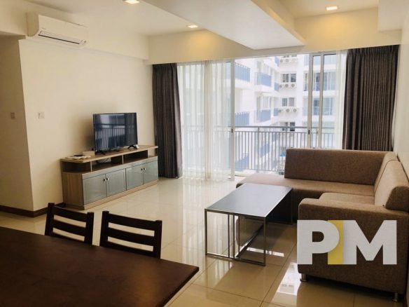 living room with sofa and TV - Myanmar Real Estate