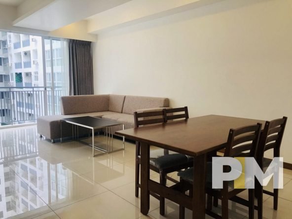 living room with sofa and dining tables - Real Estate in Myanmar