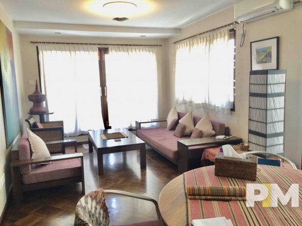 living room with table and seat - property in Yangon
