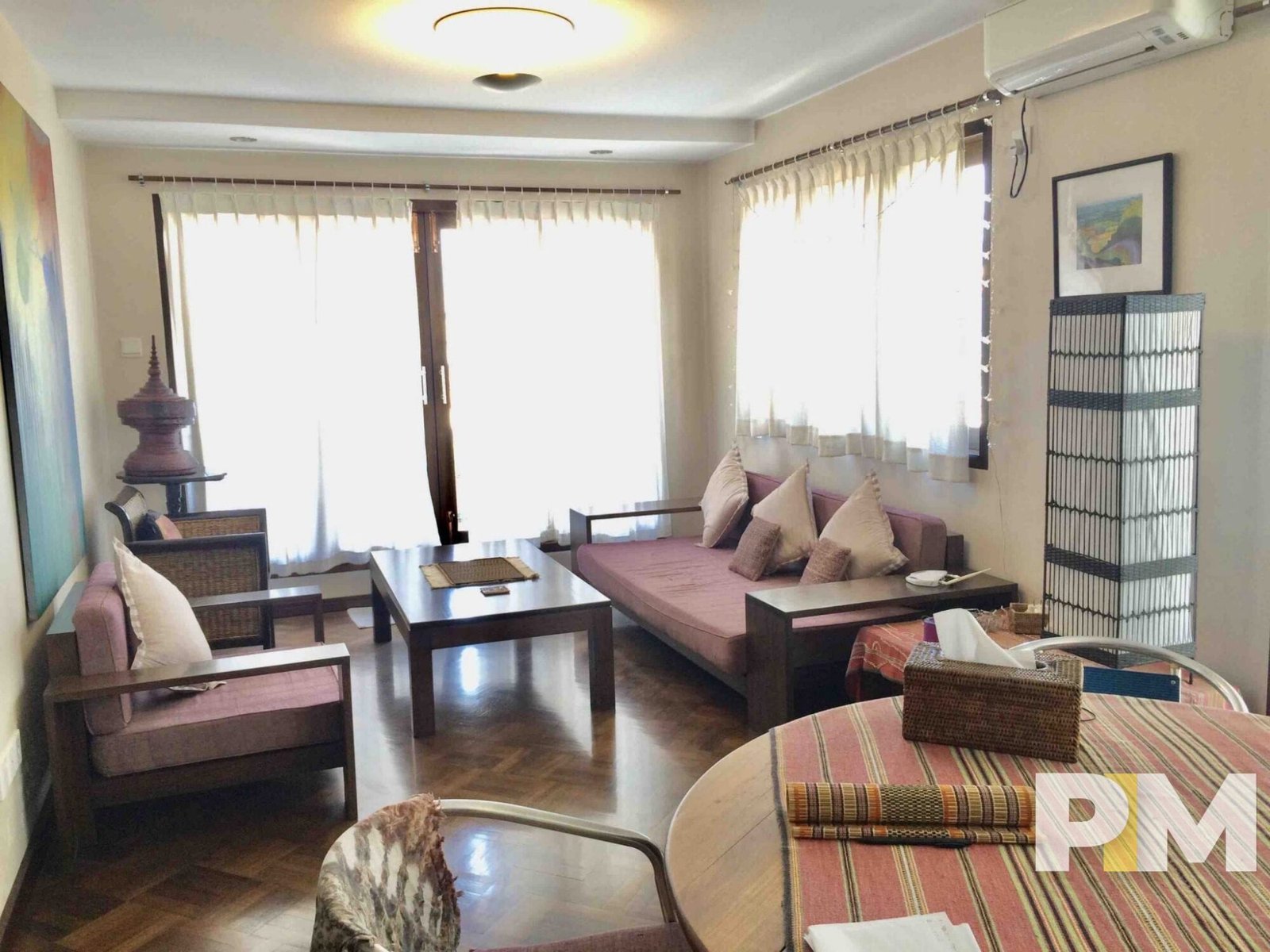 living room with table and seat - property in Yangon