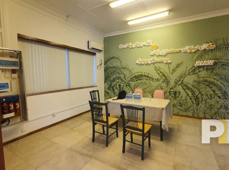 living room with tables and chairs - property in Yangon