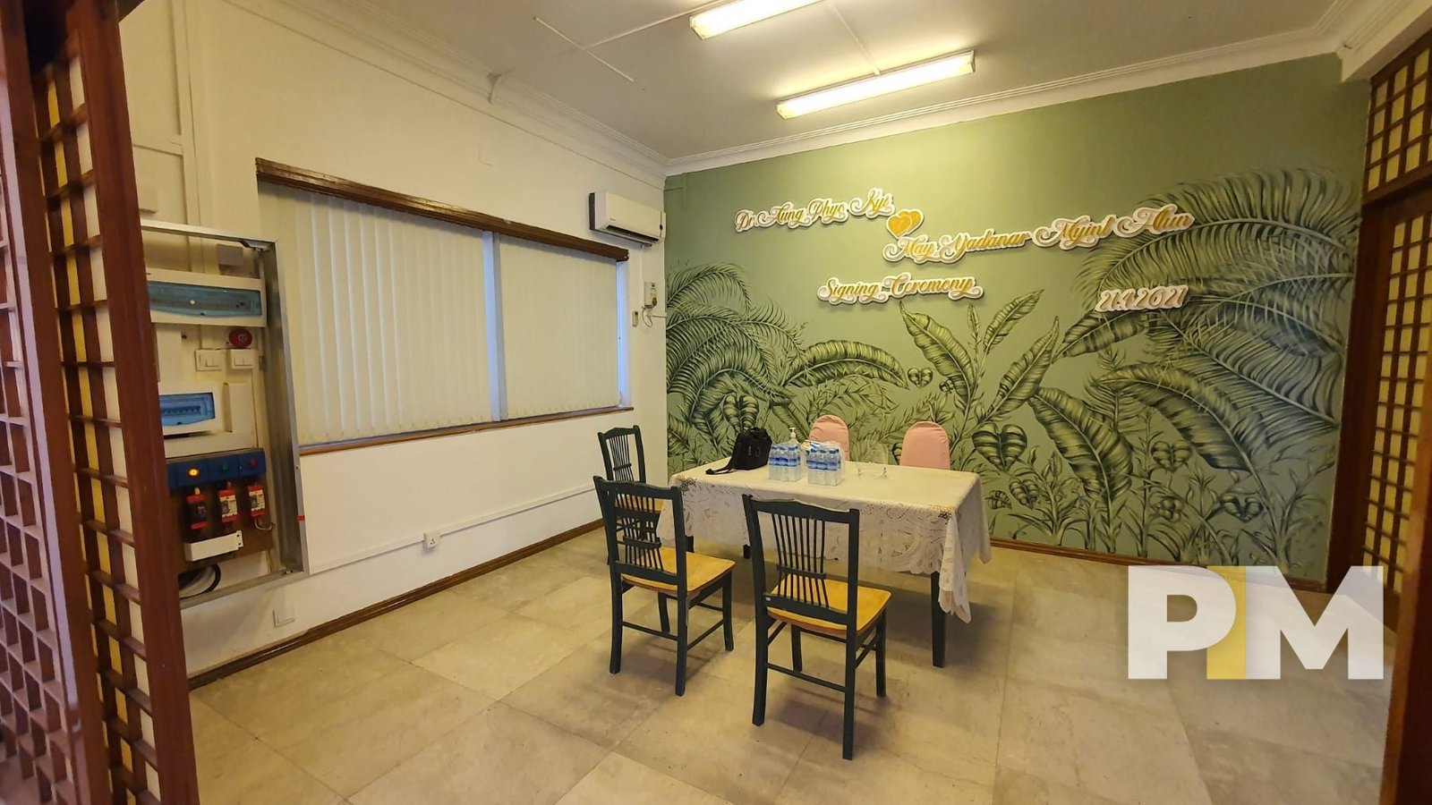 living room with tables and chairs - property in Yangon