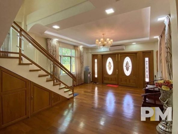 living room with under stair storage - property in Myanmar